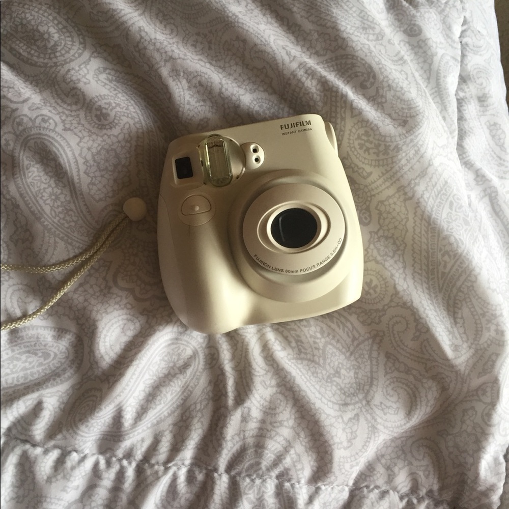 White mini fuji film polaroid camera